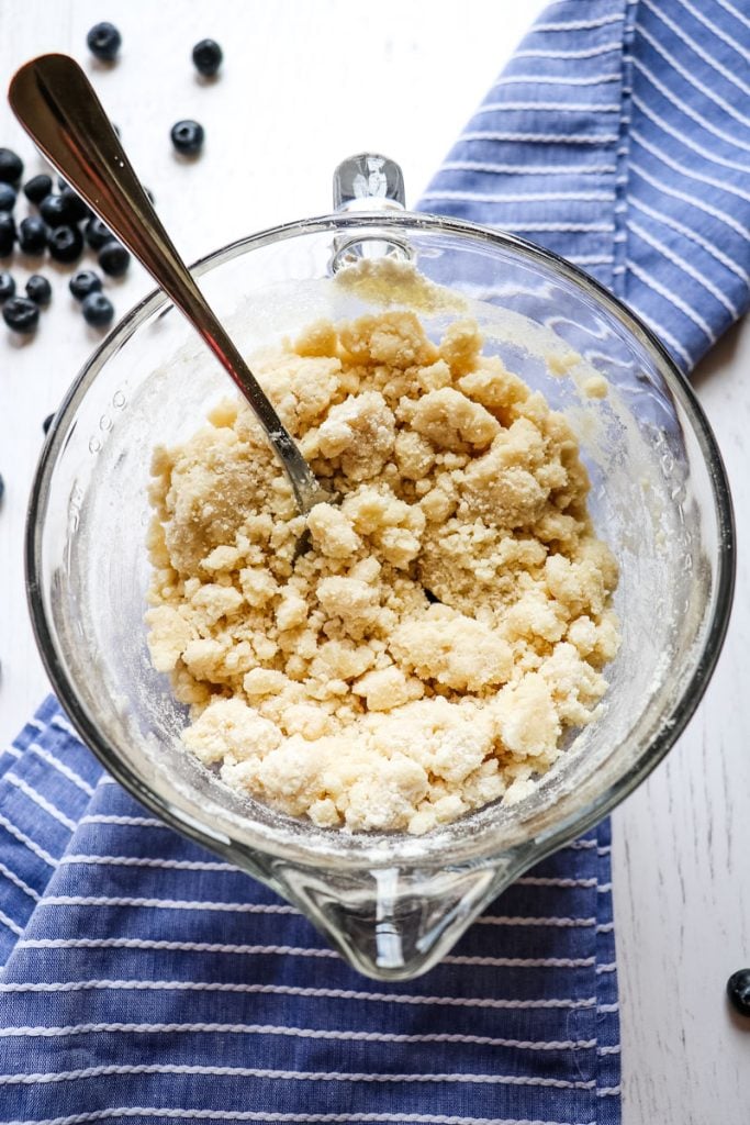 Cake mix crumble after butter has been mixed in.
