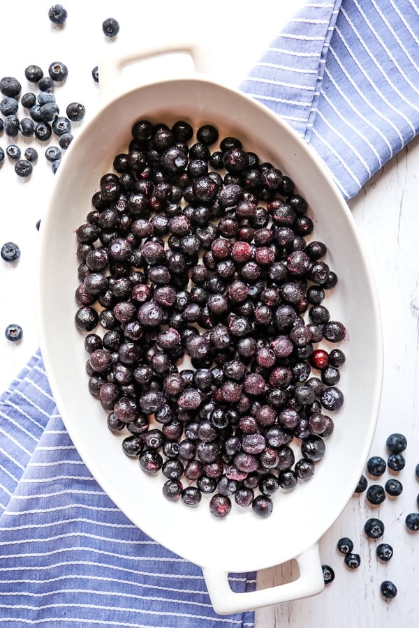 Blueberries in the bottom of a baking dish.