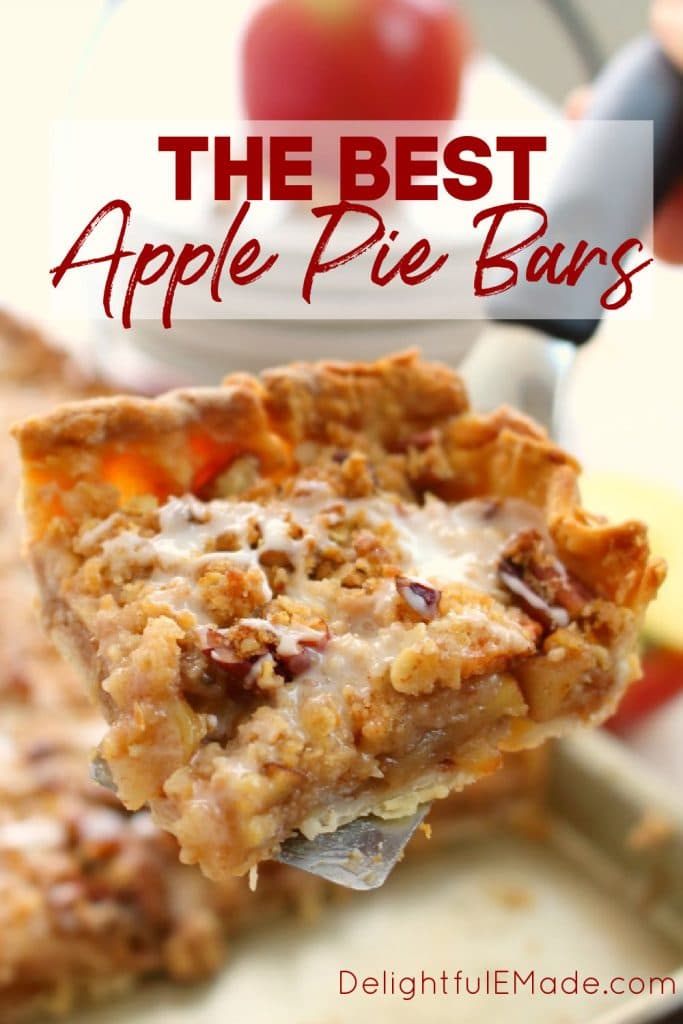 Slice of apple pie bars being held on a spatula.
