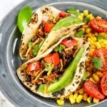 Easy taco recipes, how to make tacos from scratch, soft tacos on plate with corn salsa.