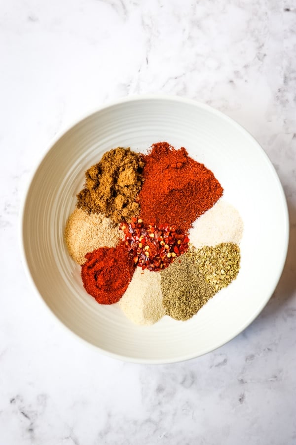 Homemade taco seasoning - spices in a white bowl.
