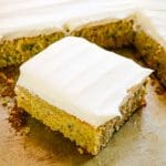 zucchini cake with cream cheese frosting, square slice of cake.