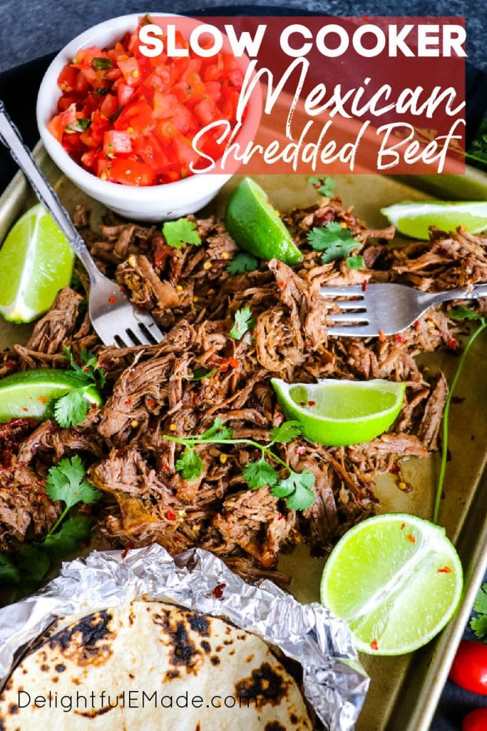 Slow cooker Mexican shredded beef barbacoa with tortillas.
