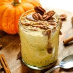 Pumpkin overnight oats topped with cinnamon, pecans and pecan butter.