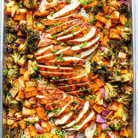 Baked sheet pan chicken and sweet potatoes, chicken sweet potato broccoli on sheet pan.