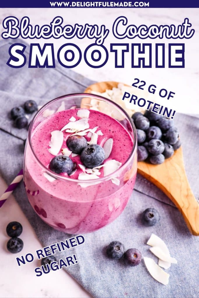 Blueberry coconut smoothie topped with fresh blueberries and coconut flakes.