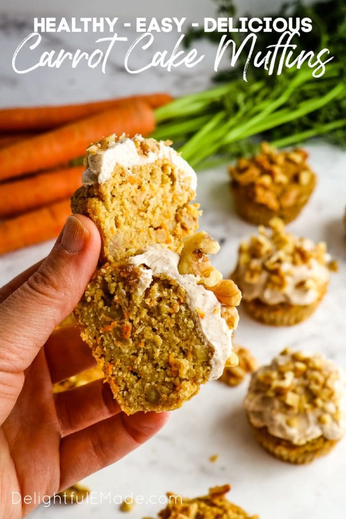 Healthy carrot cake muffins topped with cream cheese frosting and walnuts.