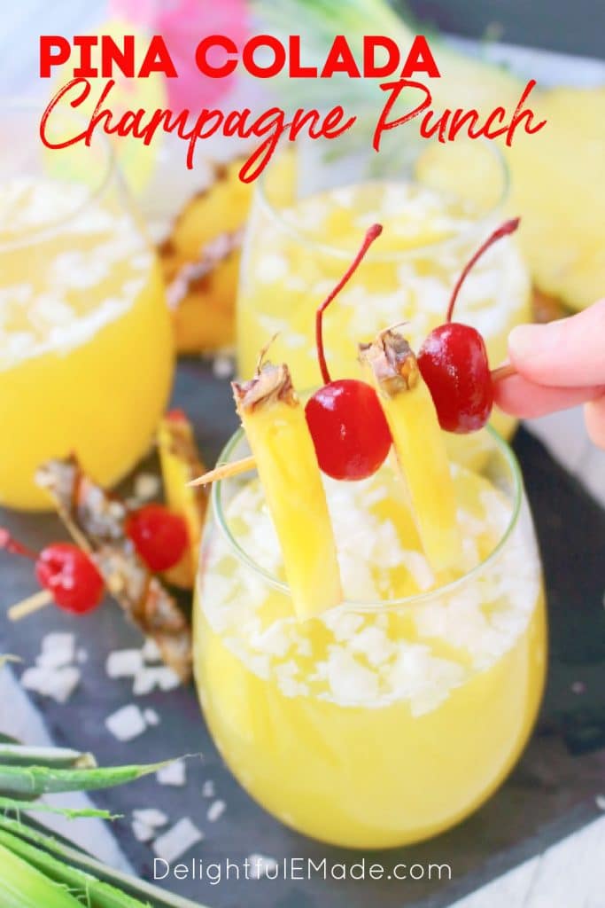 Pina colada champagne punch, glass topped with garnish, champagne punch recipe