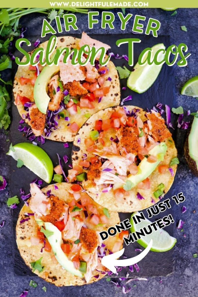 Three air fryer salmon tacos with lime wedges on the side.