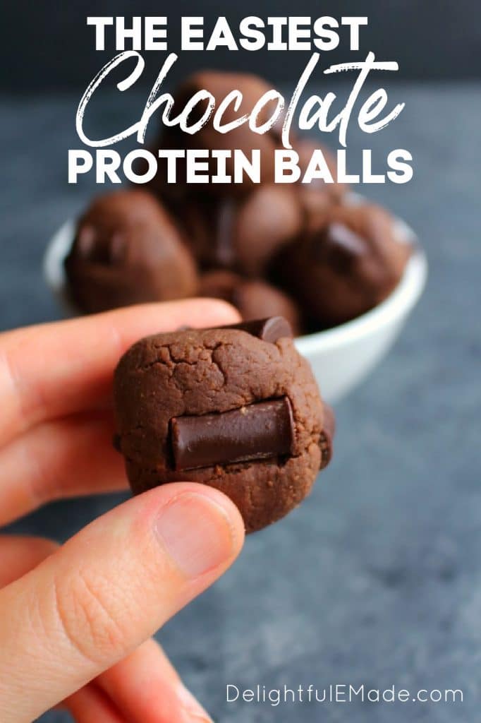 Double chocolate protein balls held in hand.