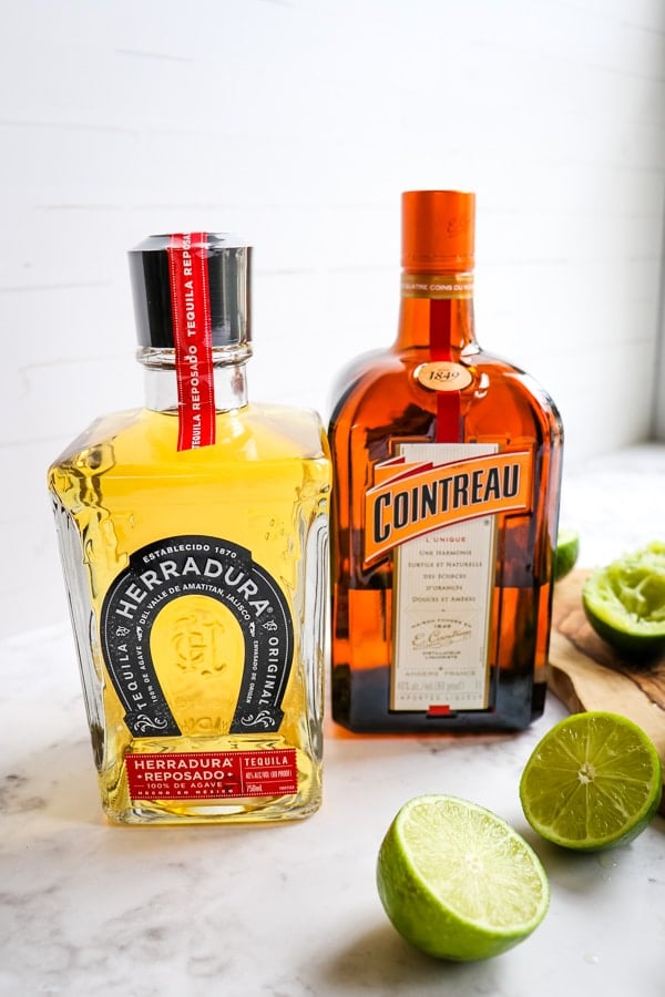 Liquor for making a margarita, tequila and cointreau.