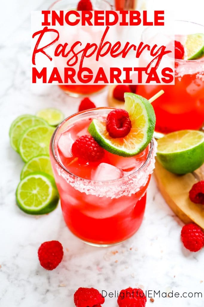 Raspberry margarita recipe on the rocks with salt and fresh lime slices and raspberries.