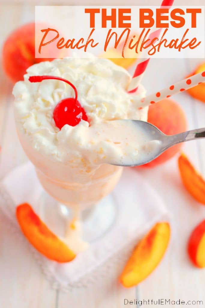 Peach milkshake recipe served in a tall glass topped with whipped cream and a cherry.