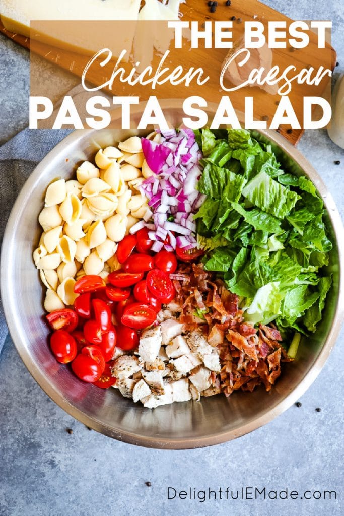 Healthy chicken caesar pasta salad in mixing bowl with ingredients separated.