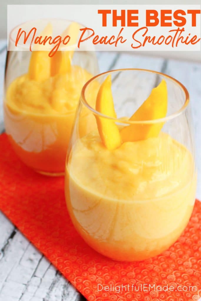 Mango peach smoothie recipe in two glasses, topped with slices of mango.