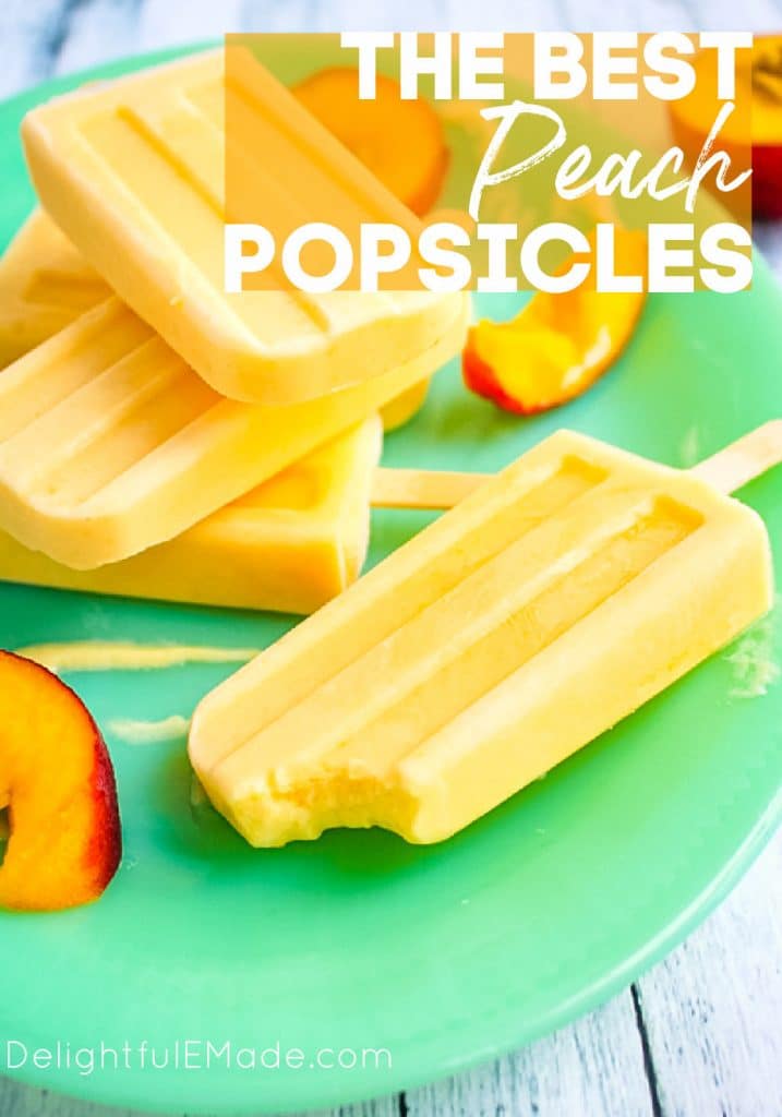 Peach Popsicles on a green platter, peach pops with bite taken out.