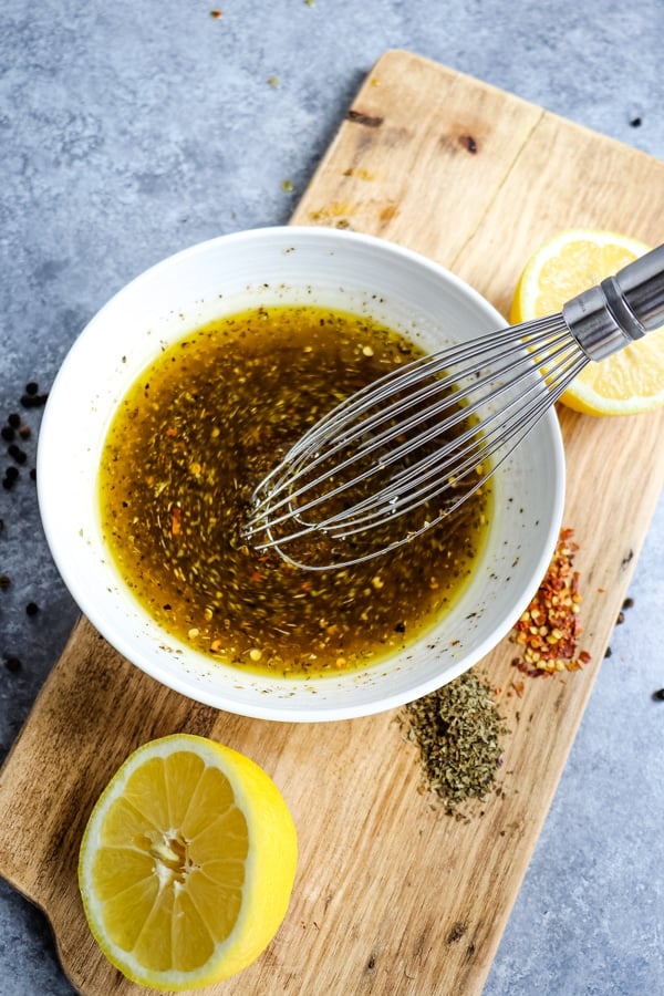 Bowl of whisked homemade Italian dressing.