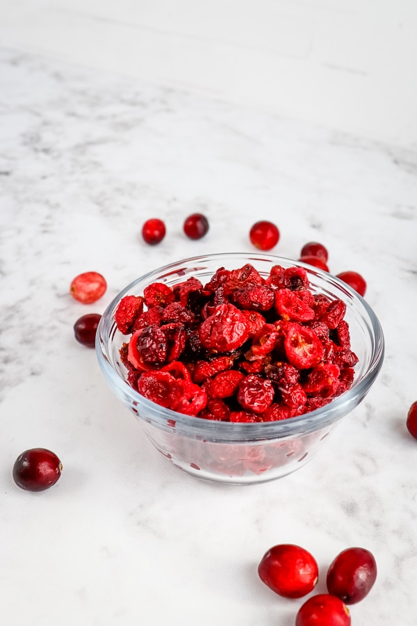 Clear bowl of dried cranberries.