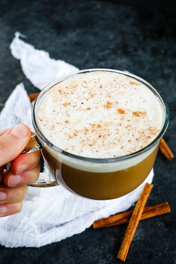 Skinny Starbucks Eggnog latte in a clear mug, topped with nutmeg.