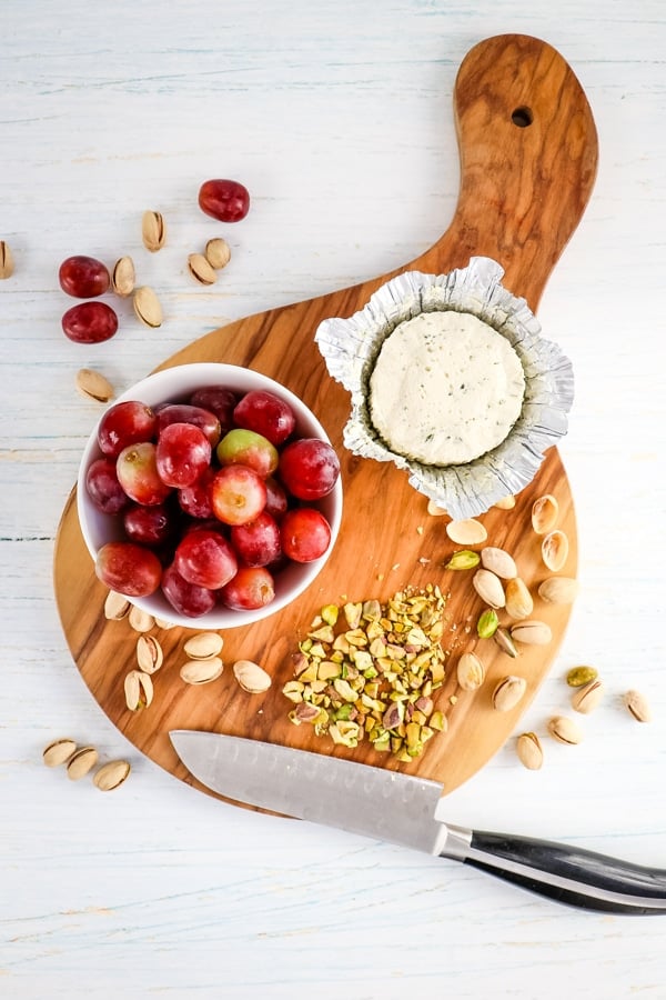 Ingredients needed for making pistachio grape and cheese appetizers.