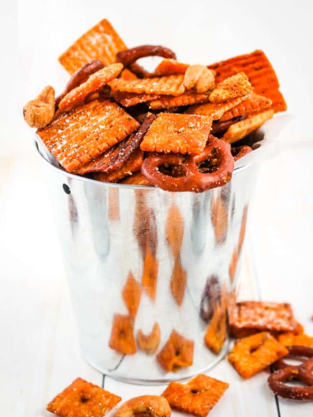 Parmesan ranch snack mix in a small silver bucket.