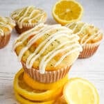 Healthy lemon poppy seed muffin, on stack of lemon slices.