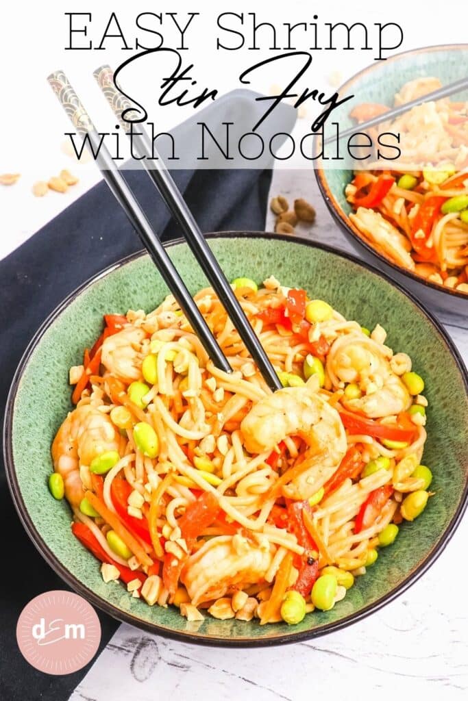 Bowl of shrimp stir fry with noodles and vegetables with chop sticks.