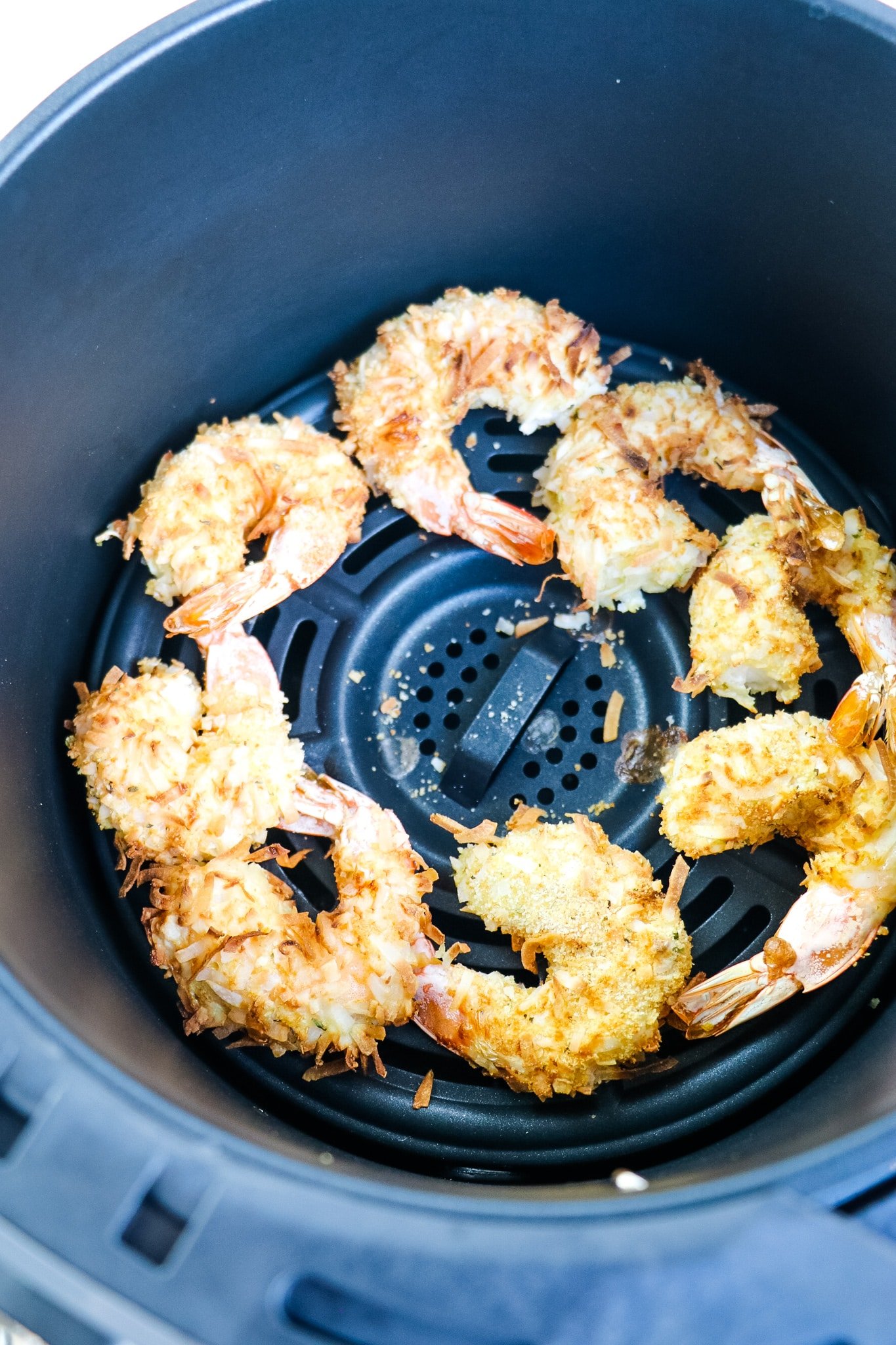 Cooked coconut shrimp in air fryer.