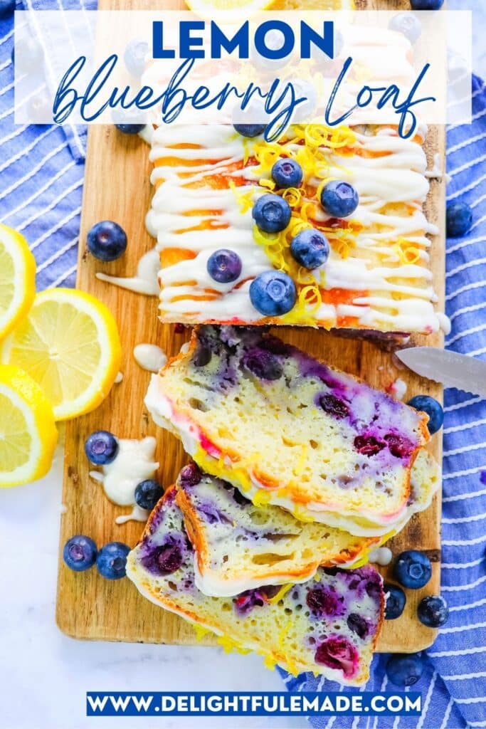 Lemon blueberry loaf, with three slices cut, lemon sliced and blueberries on the side.