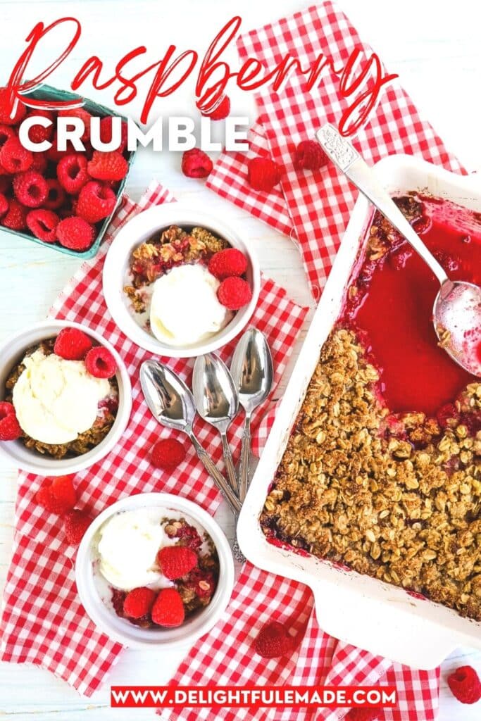 Baking dish of raspberry crumble, with three bowls containing crumble and scoops of vanilla ice cream.