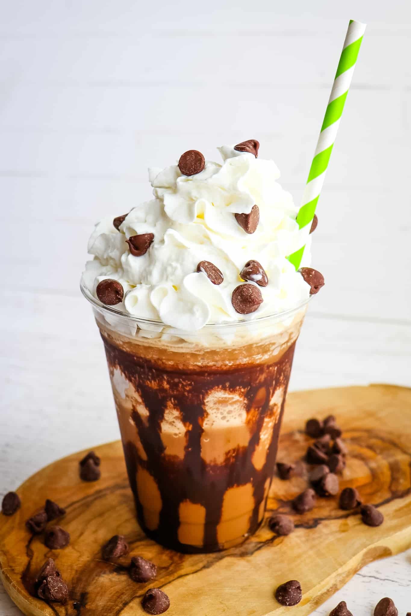Mocha frappuccino recipe topped with whipped cream and chocolate chips.