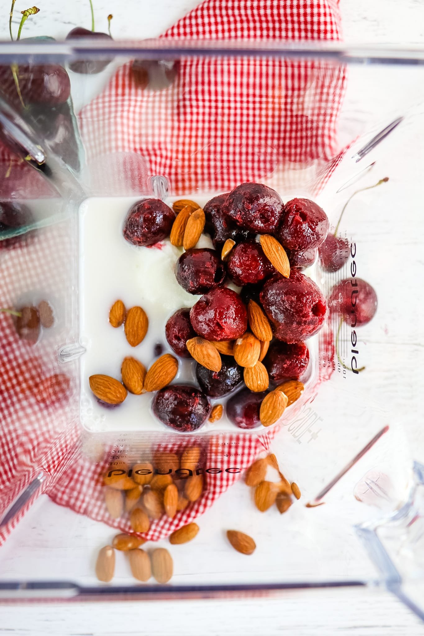 Ingredients in blender for cherry smoothie.