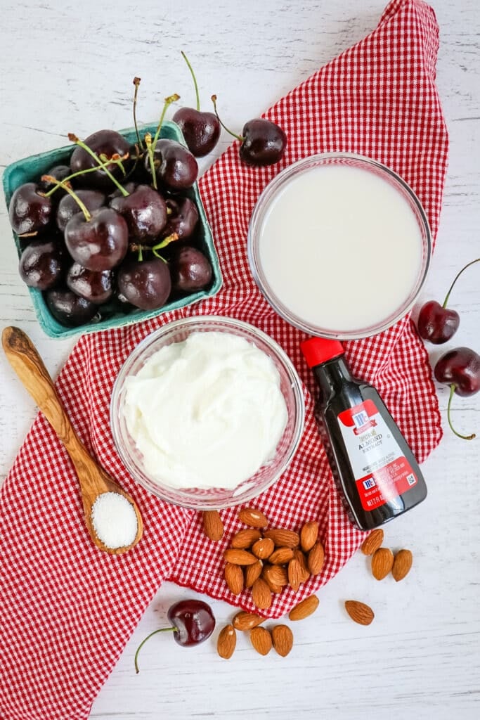 Ingredients needed to make a cherry smoothie.