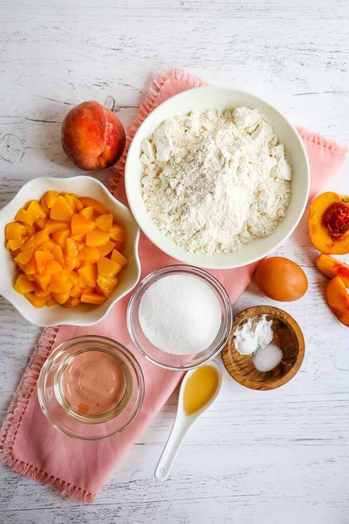 Ingredients needed to make peach muffins.
