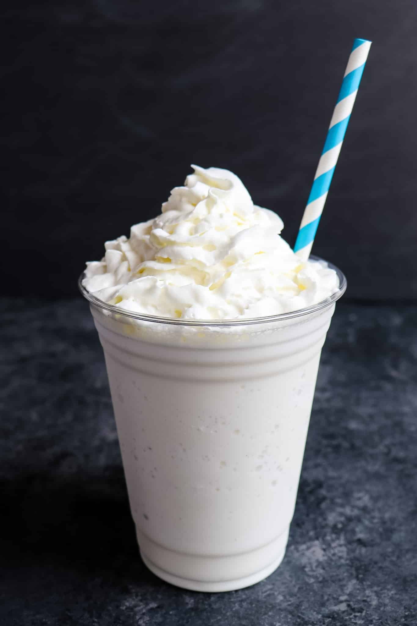 Vanilla bean frappuccino topped with whipped cream.