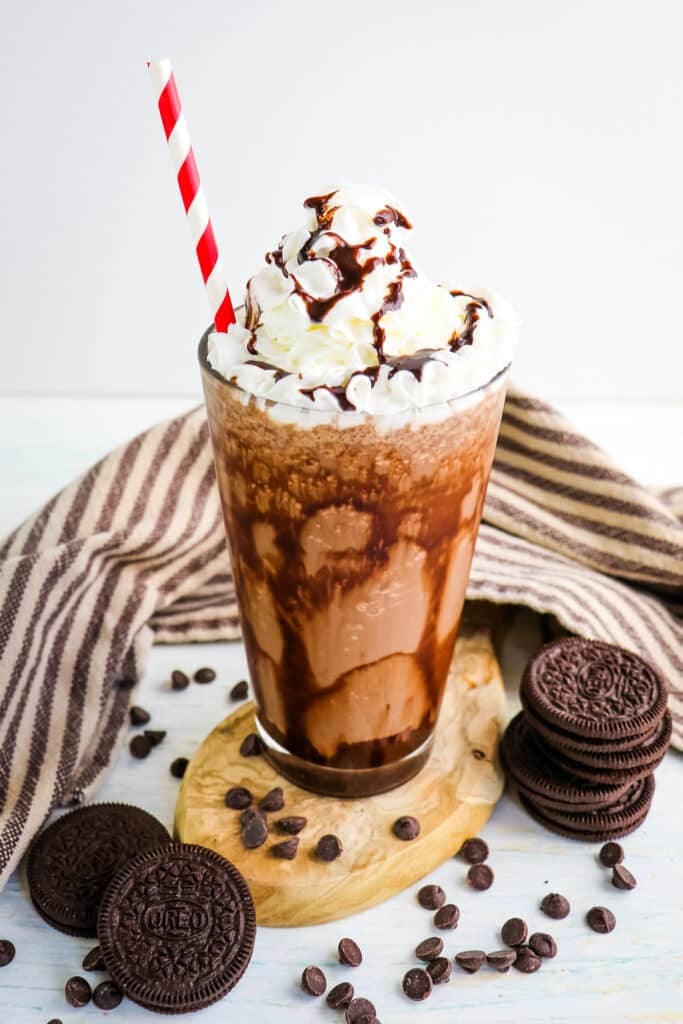 Starbucks mocha cookie crumble frappuccino recipe topped with whipped cream and chocolate sauce.