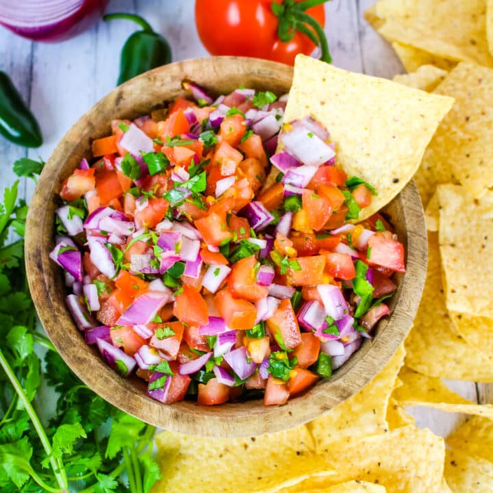 Pico de gallo salsa with tortilla chips on the side.