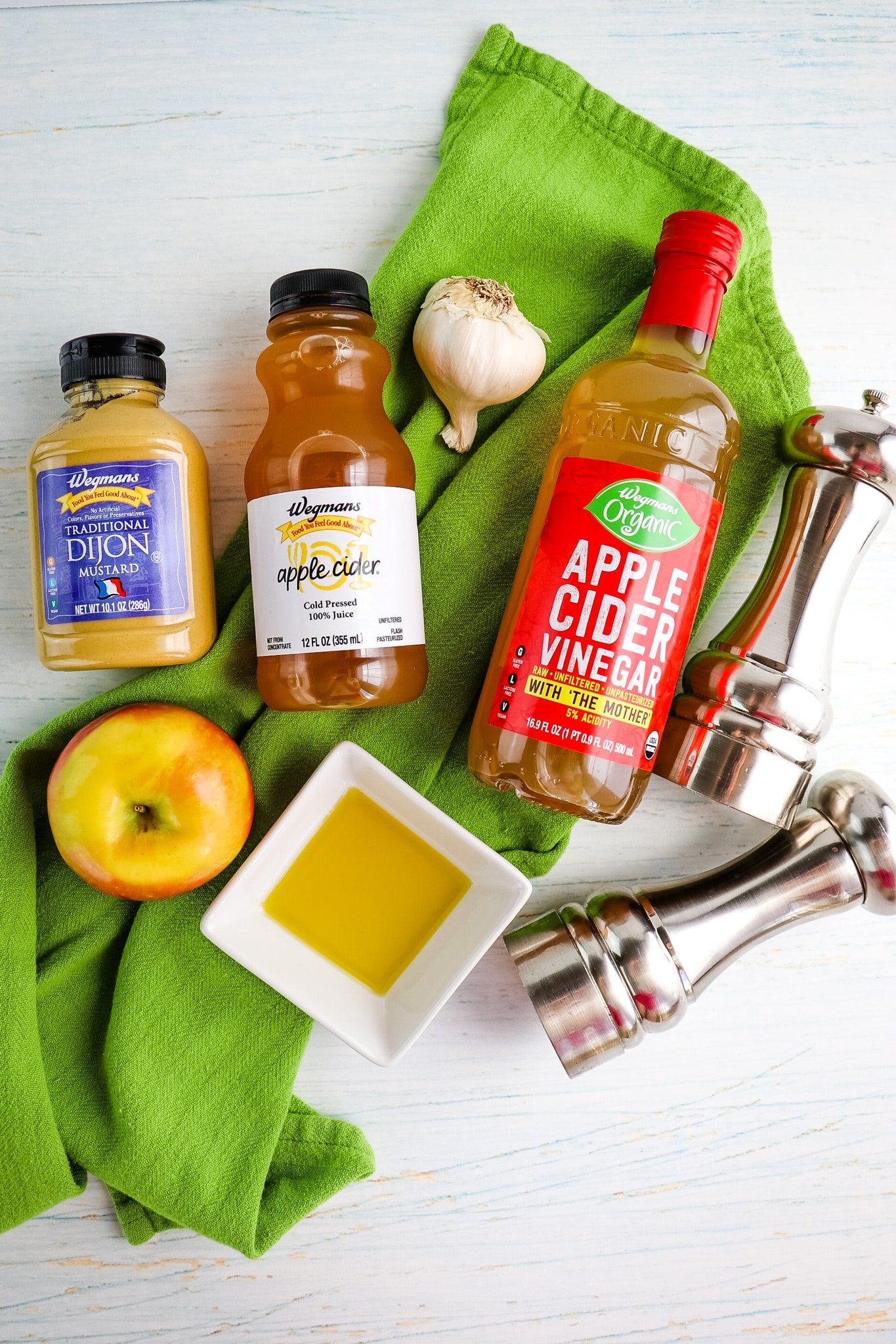 Dressing ingredients to make an apple cider vinaigrette for apple kale salad.