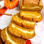 Cream cheese pumpkin bread with slices on their side.