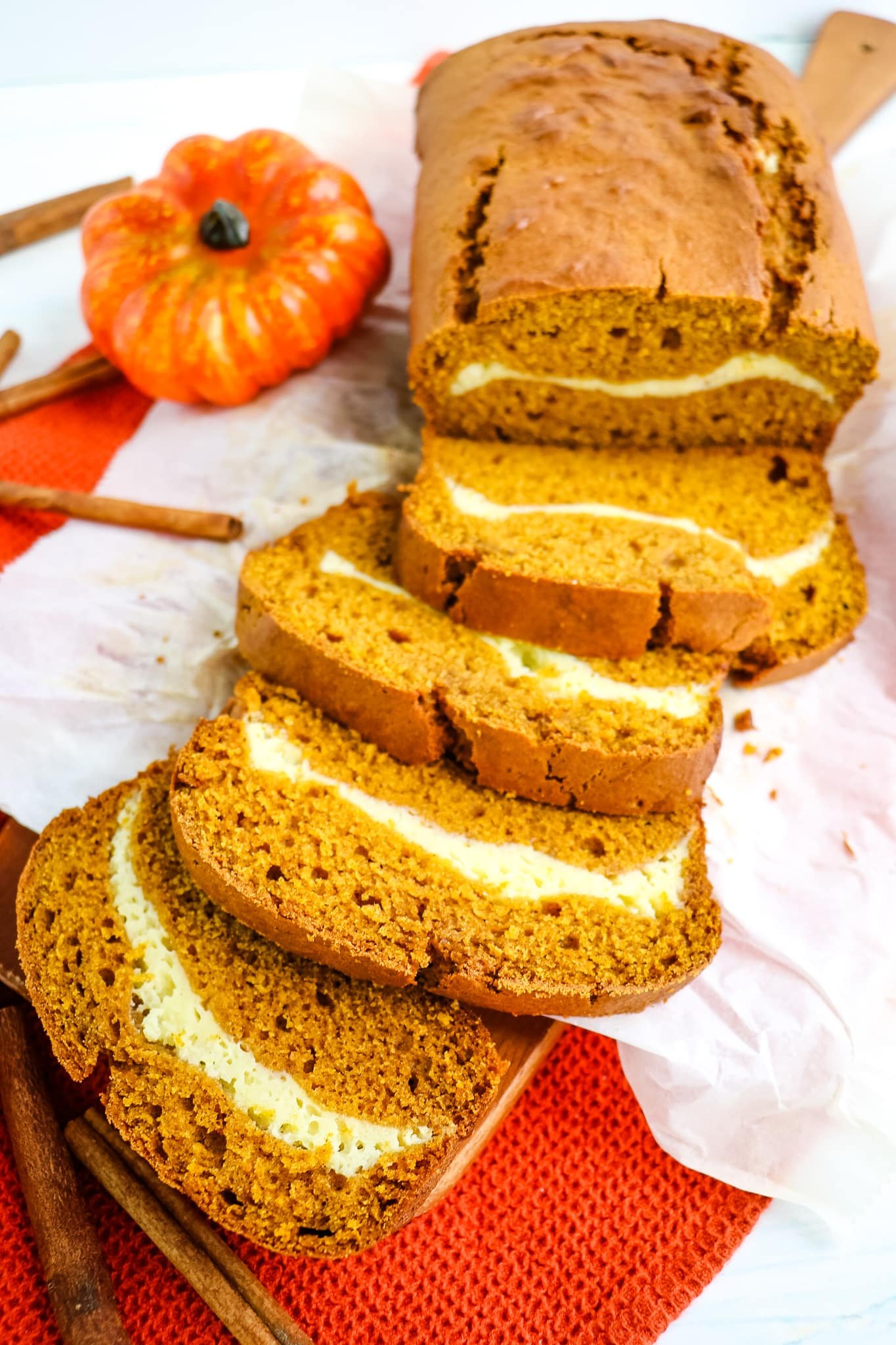 Cream cheese pumpkin bread with slices on their side.