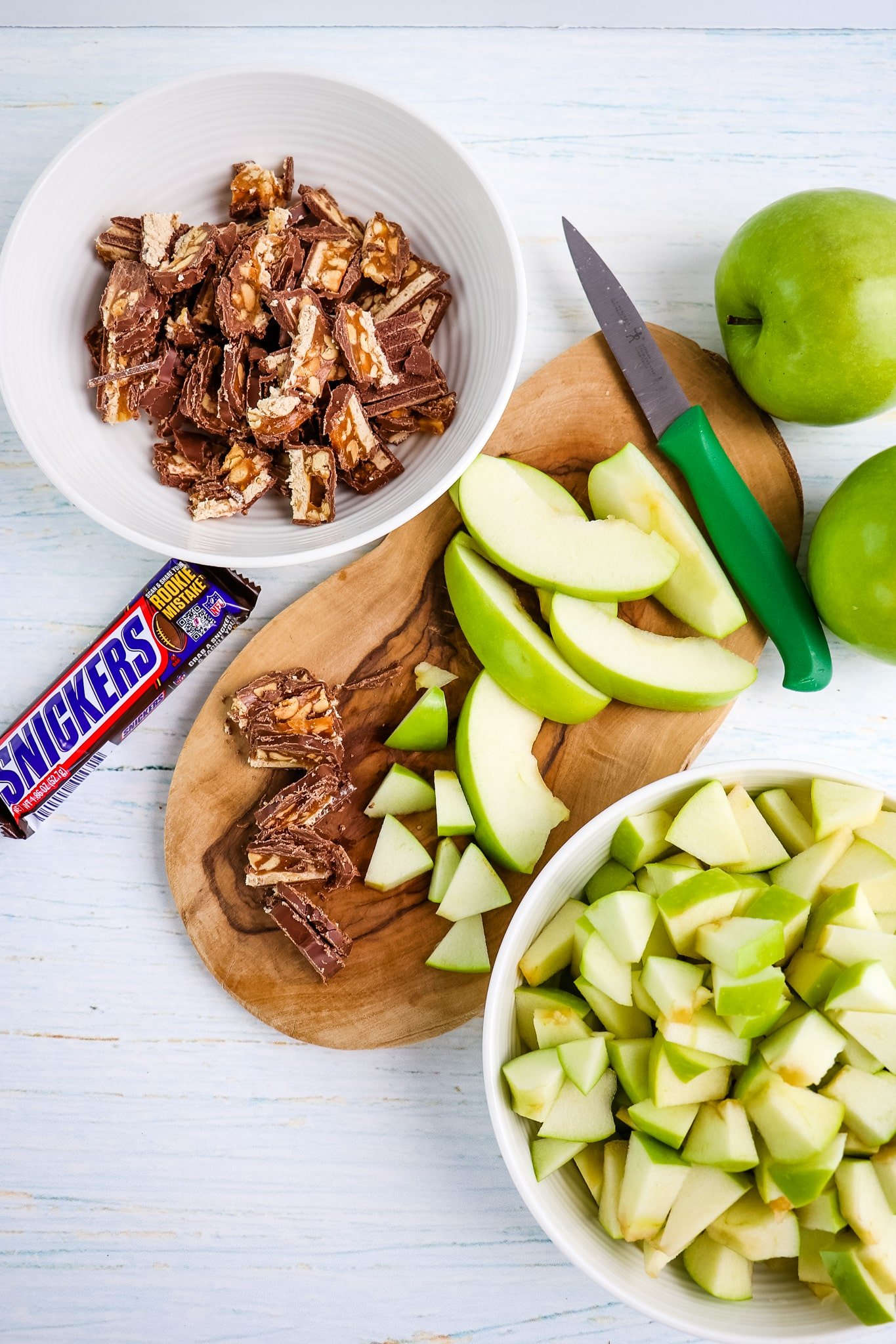Chopped apples and Snickers bars for Snickers apple salad.