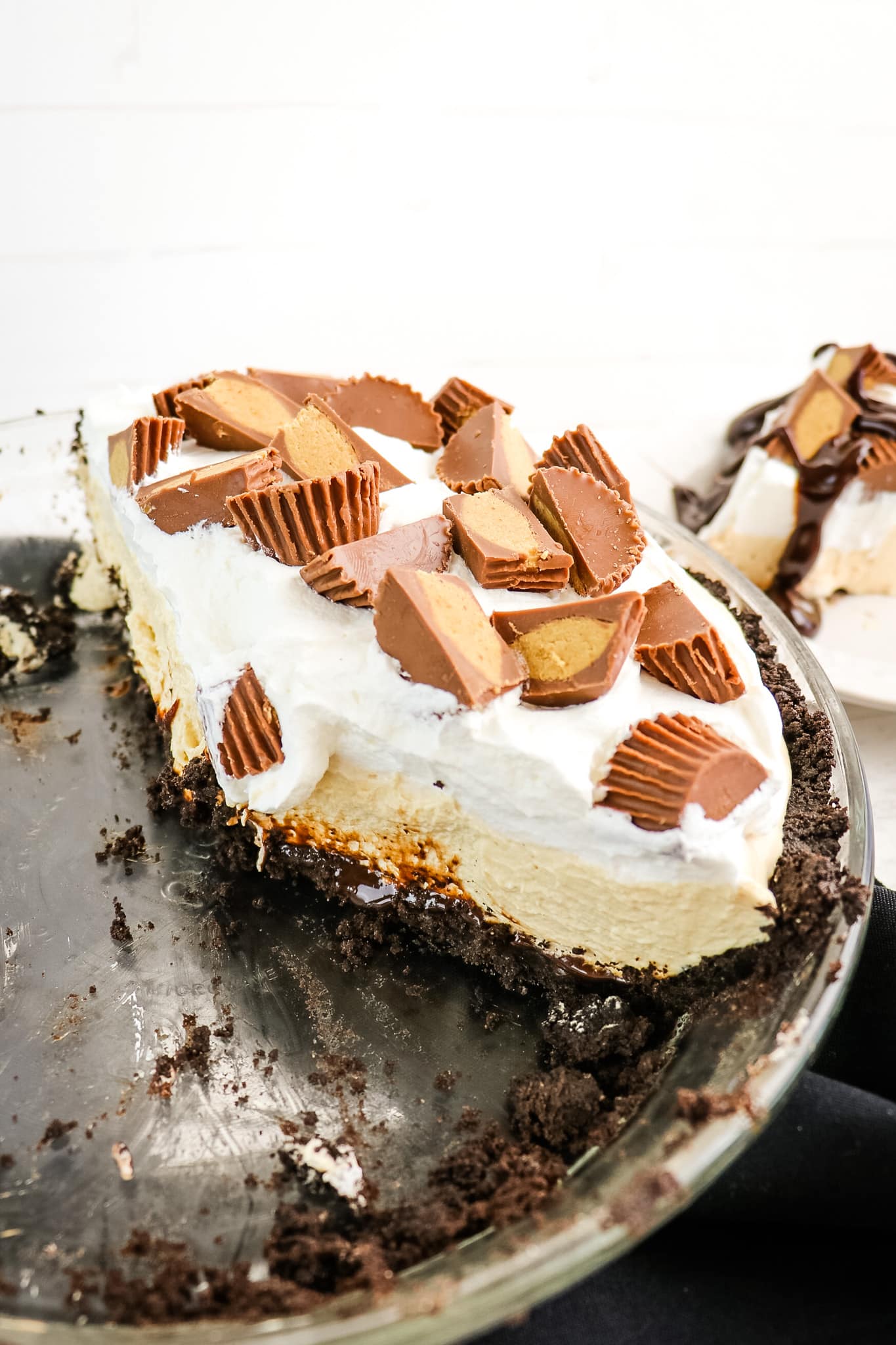 Reese's peanut butter pie sliced and in pie plate.