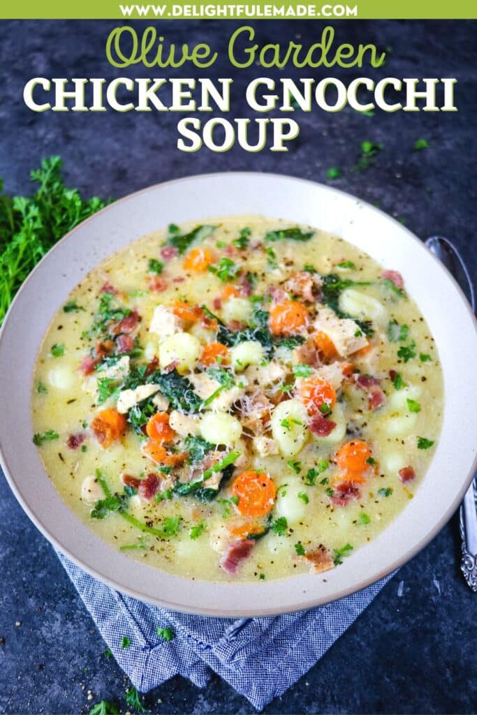 Olive garden gnocchi soup in a bowl topped with Parmesan cheese.