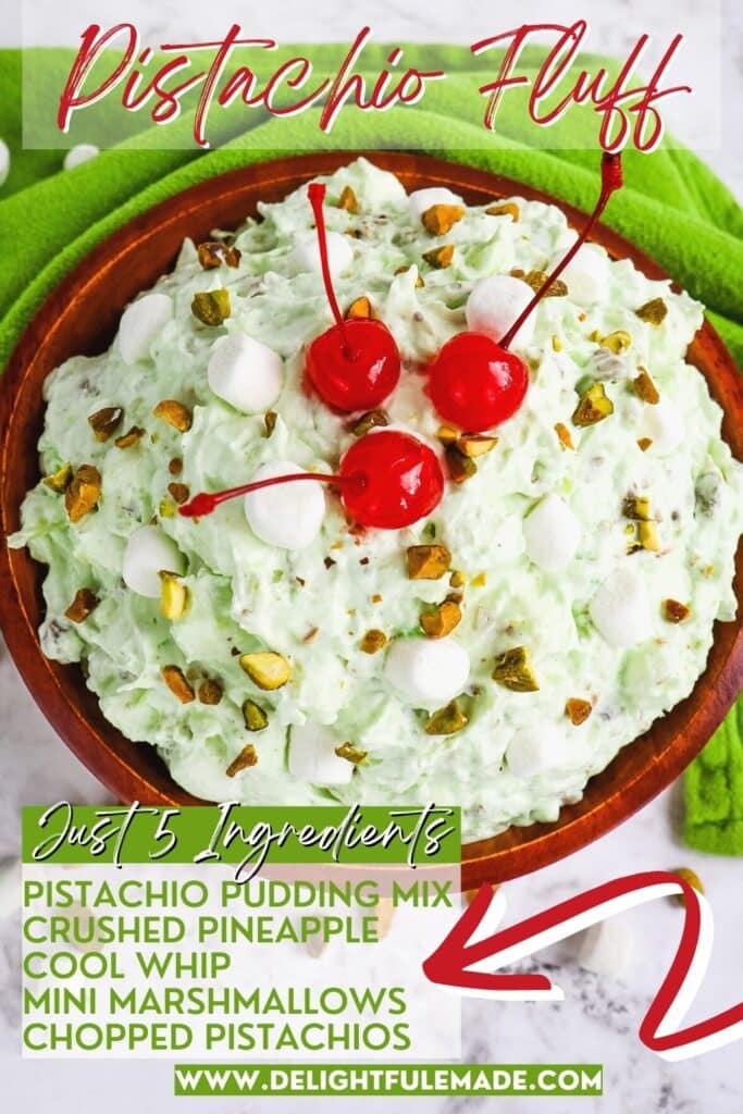 Pistachio fluff salad in a bowl topped with three maraschino cherries.