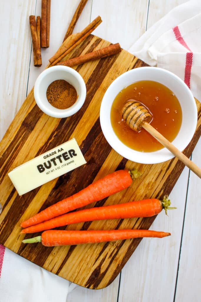 Ingredients needed to make a sauteed carrots recipe.