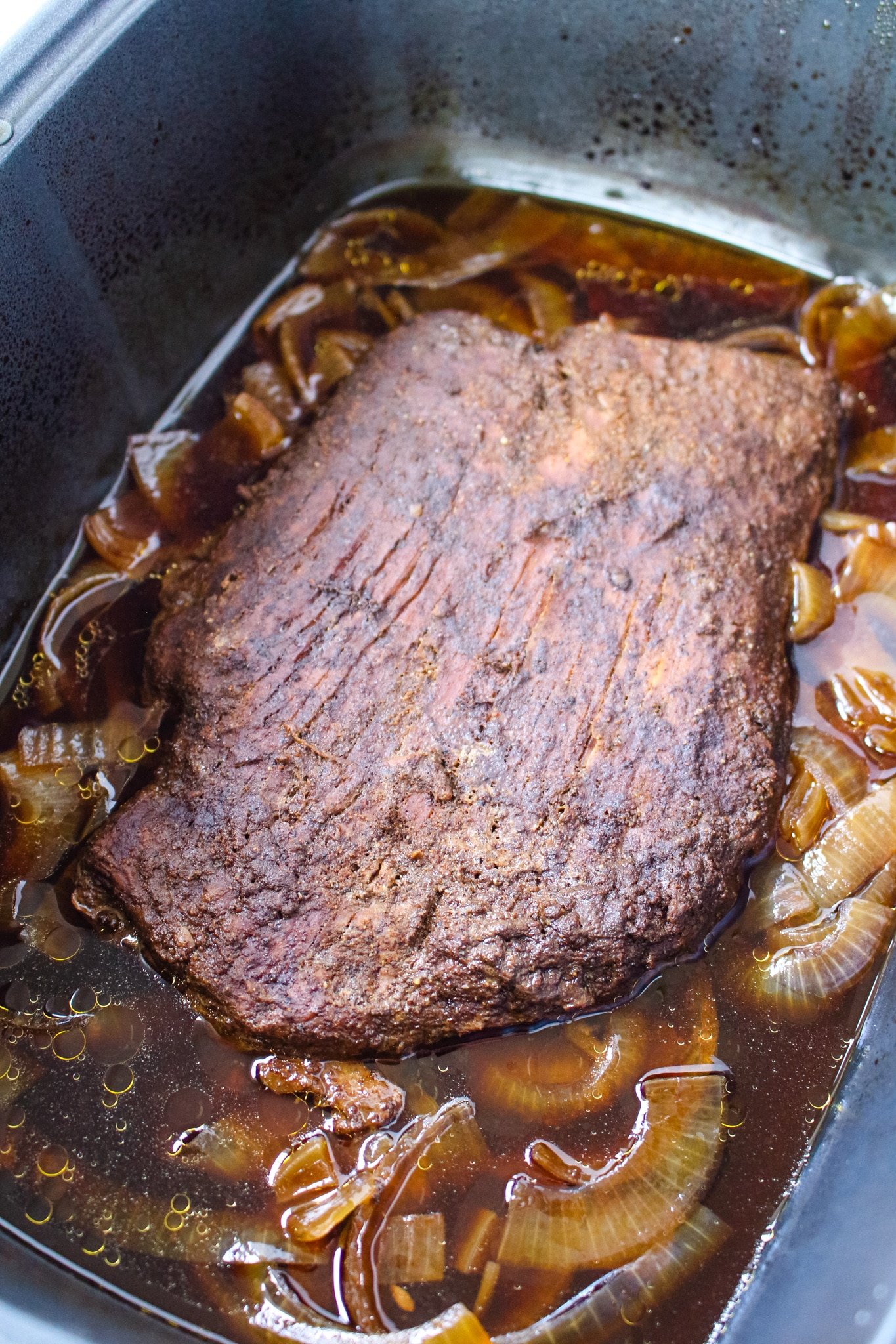 Cooked beef brisked in slow cooker.