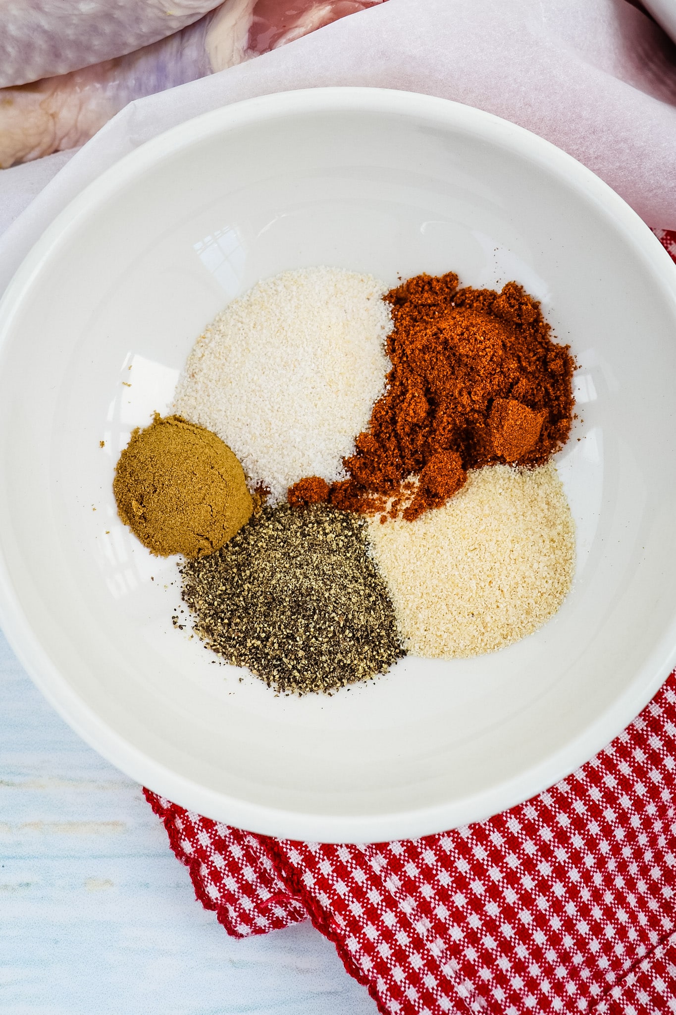 Spices in a bowl for air fryer drumsticks recipe.
