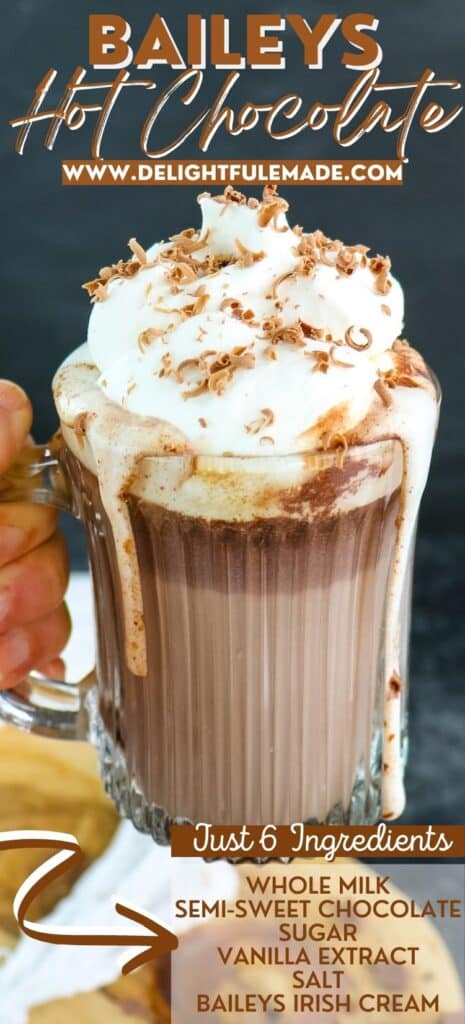 Baileys hot chocolate recipe in a mug topped with whipped cream and chocolate shavings.