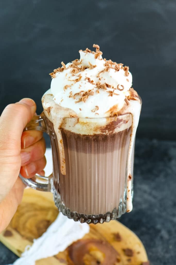 Baileys hot chocolate topped with whipped cream and chocolate shavings.