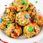 Peanut butter oatmeal balls on a plate with mini M&M's.